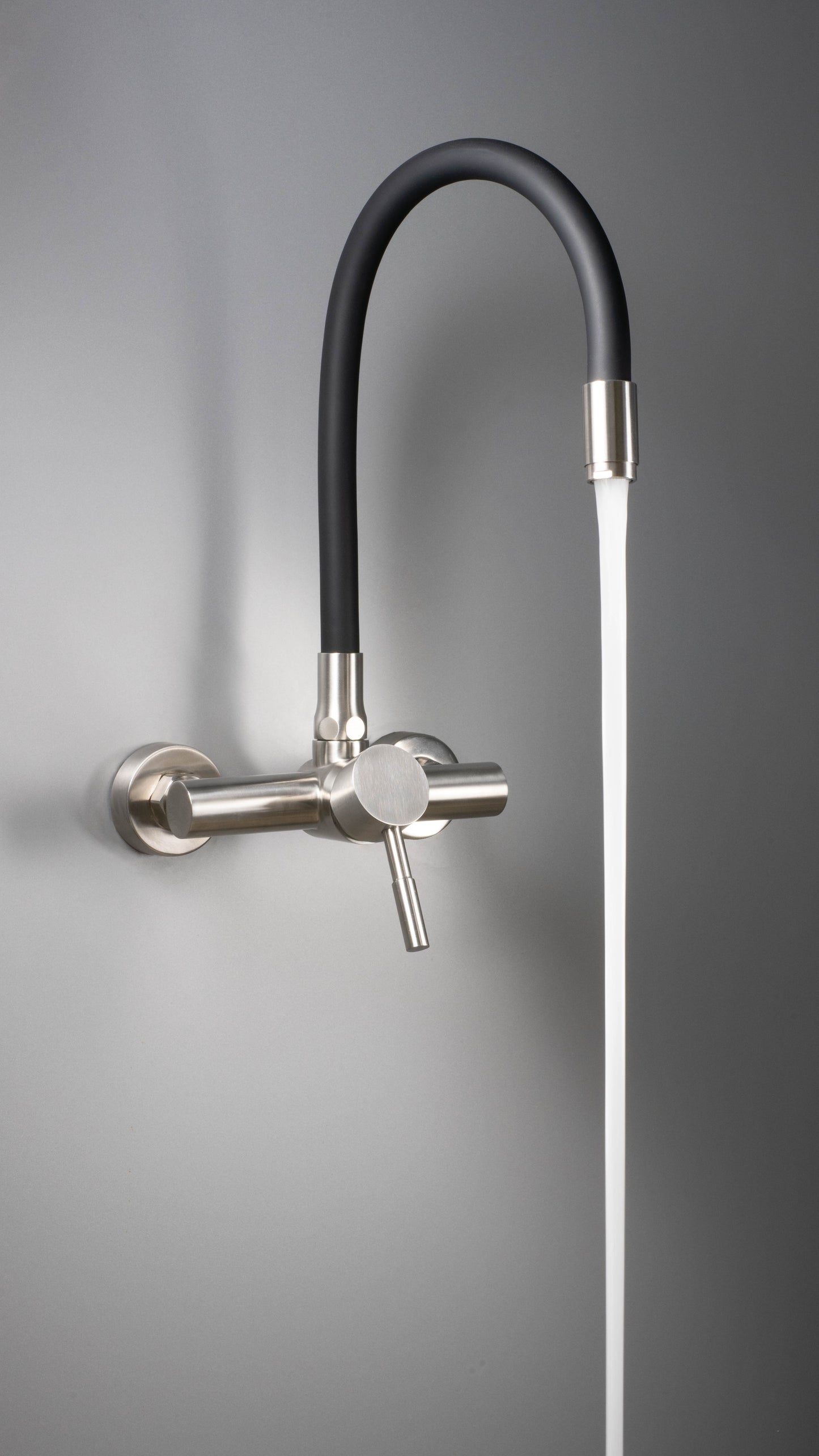 Kitchen tap, wall-mounted, with bendable spout